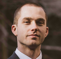 Thomas Whitfield, trading analyst at a crypto market firm, headshot.